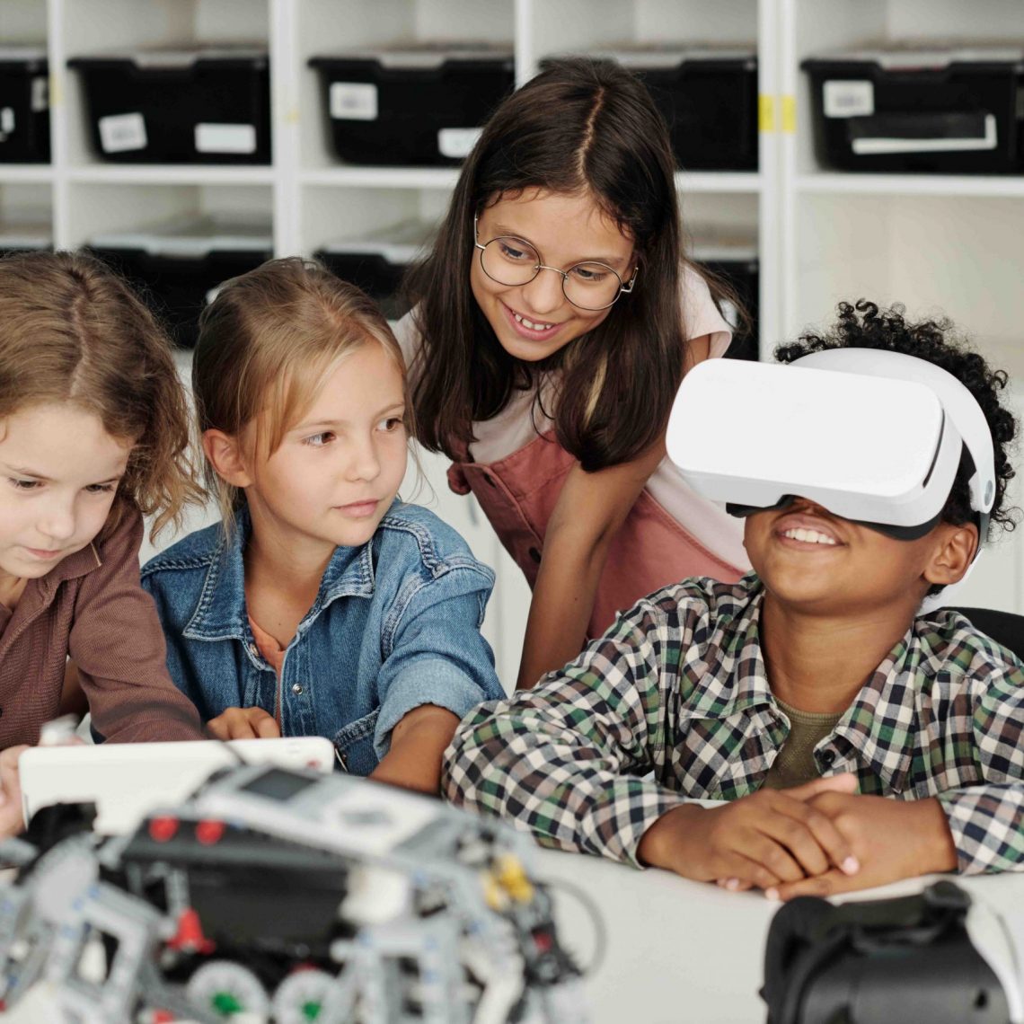 group-of-schoolchildren-stting-by-desk-while-one-o-2025-03-13-12-41-21-utc