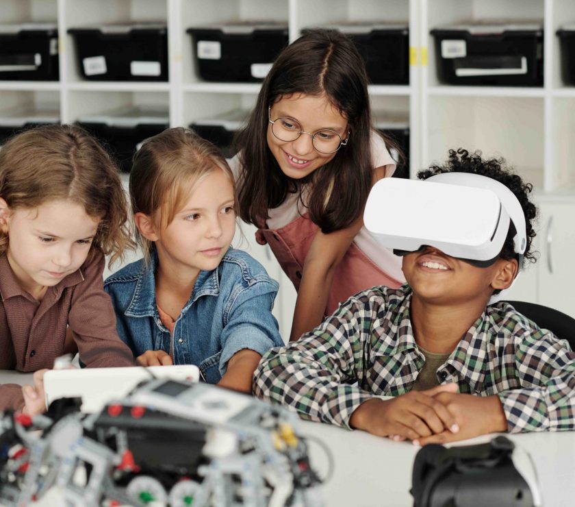 group-of-schoolchildren-stting-by-desk-while-one-o-2025-03-13-12-41-21-utc